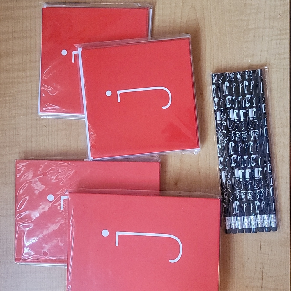Set of Michael's journals, note cards, and pencils.
